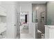 Bathroom featuring a modern shower and an open doorway to a bedroom with a ceiling fan at 8802 Sw 79Th Loop, Ocala, FL 34481