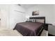 Bedroom with carpet floors, a ceiling fan, queen bed, and sliding closet doors at 8802 Sw 79Th Loop, Ocala, FL 34481