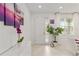 Bright entryway with modern decor, featuring a decorative orchid, artwork, and natural light at 8802 Sw 79Th Loop, Ocala, FL 34481