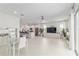 Spacious open living area with lots of seating, open kitchen, and bright white theme at 8802 Sw 79Th Loop, Ocala, FL 34481