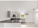 Modern kitchen features stainless steel appliances, gray cabinets, and breakfast bar at 9 Redwood Run Trce, Ocala, FL 34481