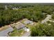 Areal view of home showing surrounding greenery, backyard, landscaping, neighboring houses, and community layout at 9432 Se 159Th Ln, Summerfield, FL 34491