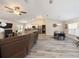 Bright living room featuring gray floors and a view of the adjacent dining area at 9432 Se 159Th Ln, Summerfield, FL 34491
