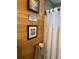 Bathroom with wood paneling and framed pictures at 1013 Nw Mandrake Dr, Dunnellon, FL 34431
