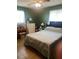Bedroom with natural light, neutral tones, and a comfortable bed setting at 1013 Nw Mandrake Dr, Dunnellon, FL 34431