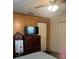 Comfortable bedroom featuring a wood accent wall and simple decor at 1013 Nw Mandrake Dr, Dunnellon, FL 34431