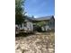 View of a single Gathering home with siding and green shutters, in a rural area at 1013 Nw Mandrake Dr, Dunnellon, FL 34431