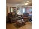 Cozy living room with comfortable seating, accent pillows, and tile flooring at 1013 Nw Mandrake Dr, Dunnellon, FL 34431