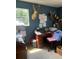 Home office featuring a large window and a rustic desk with various decorations at 1013 Nw Mandrake Dr, Dunnellon, FL 34431