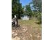 Exterior view of a small outbuilding with trees surrounding it at 1013 Nw Mandrake Dr, Dunnellon, FL 34431