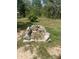 Spacious yard featuring unique rock structures, enhancing the outdoor aesthetic at 1013 Nw Mandrake Dr, Dunnellon, FL 34431