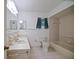 Bathroom features tiled floor and shower-tub and single sink vanity at 10699 Se 178Th St, Summerfield, FL 34491