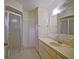 Bathroom view showing a corner shower with tiled floor and single sink vanity at 10699 Se 178Th St, Summerfield, FL 34491