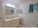 Bathroom features tiled floor and shower-tub and single sink vanity at 10699 Se 178Th St, Summerfield, FL 34491