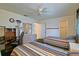Comfortable bedroom with twin beds, desk, and dresser creating a functional and inviting space at 10699 Se 178Th St, Summerfield, FL 34491