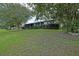 Charming single-story home featuring a well-maintained lawn and mature landscaping in a tranquil neighborhood at 10699 Se 178Th St, Summerfield, FL 34491