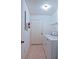 Laundry room featuring tiled floors and white washer and dryer at 10699 Se 178Th St, Summerfield, FL 34491
