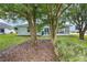 Backyard view of the home, highlighting the outdoor living space and landscaping at 11051 Sw 73Rd Ct, Ocala, FL 34476