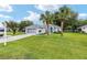 Inviting home with a well-maintained lawn and a two-car garage and a garden in the front at 11051 Sw 73Rd Ct, Ocala, FL 34476