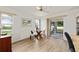 Bright office with modern desk, shelving unit, sitting area and outside view at 11051 Sw 73Rd Ct, Ocala, FL 34476