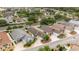 Beautiful aerial view of well-maintained homes, lush landscaping, and palm trees in a desirable neighborhood at 1204 Flamingo Pl, The Villages, FL 32162