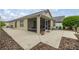View of the backyard, screened-in lanai and patio featuring outdoor seating at 1204 Flamingo Pl, The Villages, FL 32162