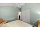 Cozy bedroom featuring a ceiling fan and closet at 1204 Flamingo Pl, The Villages, FL 32162
