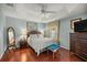 Bright bedroom with a ceiling fan and nice furniture at 1204 Flamingo Pl, The Villages, FL 32162