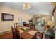 Cozy dining area open to the living room, ideal for Gathering gatherings at 1204 Flamingo Pl, The Villages, FL 32162