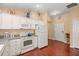 Well-equipped kitchen featuring modern appliances and plenty of cabinet storage at 1204 Flamingo Pl, The Villages, FL 32162