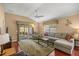 Inviting living area with comfortable seating and access to outdoor patio at 1204 Flamingo Pl, The Villages, FL 32162