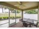 Screened-in patio with outdoor furniture and views of a fenced backyard at 1204 Flamingo Pl, The Villages, FL 32162