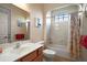 Bathroom features a shower-tub combination, a vanity with marble countertop, and ceramic tile flooring at 12169 Se 172Nd Ln, Summerfield, FL 34491