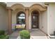 Charming front porch with decorative columns and a cozy bench, creating an inviting entrance at 12169 Se 172Nd Ln, Summerfield, FL 34491