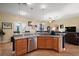 Open kitchen with stainless steel appliances, granite countertops, and natural light from the breakfast nook at 12169 Se 172Nd Ln, Summerfield, FL 34491