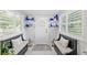 Charming entryway featuring stylish decor, white tile flooring, and built-in benches, creating a welcoming space at 12335 Se 130Th Ct, Ocklawaha, FL 32179