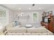Cozy living room with stylish decor, including seaside-themed artwork and comfortable seating, creating a relaxed ambiance at 12335 Se 130Th Ct, Ocklawaha, FL 32179