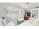 Cozy living room featuring a shelf with decor and comfortable seating with throw pillows at 12335 Se 130Th Ct, Ocklawaha, FL 32179