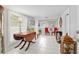 Charming living room with bright windows, tile floors, and stylish decorations at 12335 Se 130Th Ct, Ocklawaha, FL 32179