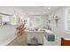 Bright and airy living space with bar seating, seamlessly blending the kitchen and living room for modern living at 12335 Se 130Th Ct, Ocklawaha, FL 32179