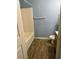 A cozy bathroom features a tiled shower/tub, wood-look flooring, and neutral fixtures at 13155 Sw 73 Ave, Ocala, FL 34473