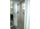 Bright bathroom featuring a shower with patterned curtain and accessible grab bar for safety at 14126 Greater Pines Blvd, Clermont, FL 34711
