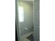 Small bathroom with toilet, window and tile floor at 14126 Greater Pines Blvd, Clermont, FL 34711