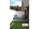 Outdoor patio with chairs and table, perfect for enjoying the backyard view at 14126 Greater Pines Blvd, Clermont, FL 34711