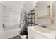 Cozy bathroom equipped with shower/tub combo and practical storage at 1434 Se Silver Springs Pl, Ocala, FL 34471