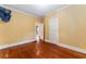 Spacious bedroom showcasing beautiful hardwood floors and natural light at 1434 Se Silver Springs Pl, Ocala, FL 34471
