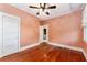 Inviting bedroom boasting hardwood floors and plenty of natural light at 1434 Se Silver Springs Pl, Ocala, FL 34471