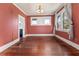 Sunlit dining room features classic hardwood floors and traditional design, great for Gathering meals at 1434 Se Silver Springs Pl, Ocala, FL 34471