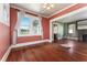 Bright dining room with hardwood floors and natural light creates a warm, inviting atmosphere at 1434 Se Silver Springs Pl, Ocala, FL 34471