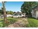 Charming single-story home featuring a well-maintained lawn, mature trees, and a quaint exterior at 1434 Se Silver Springs Pl, Ocala, FL 34471